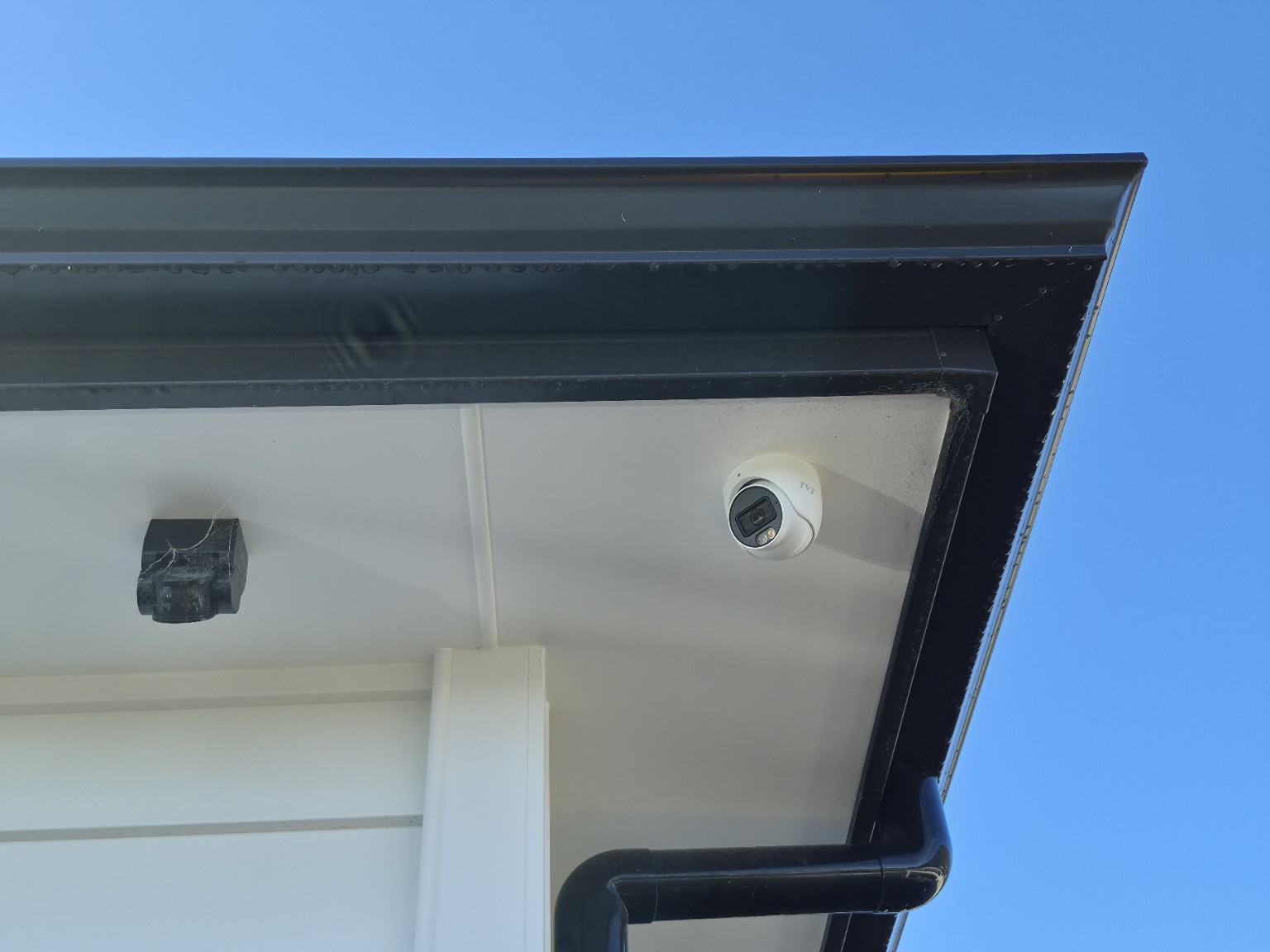 Security camera installed under the eaves of a house, Milldale