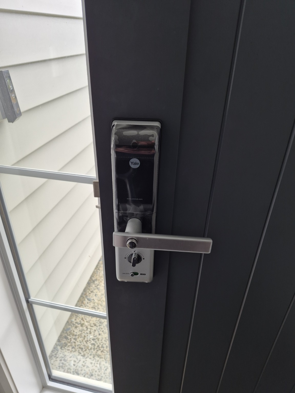 Yale digital door lock installed on a front door, Millwater